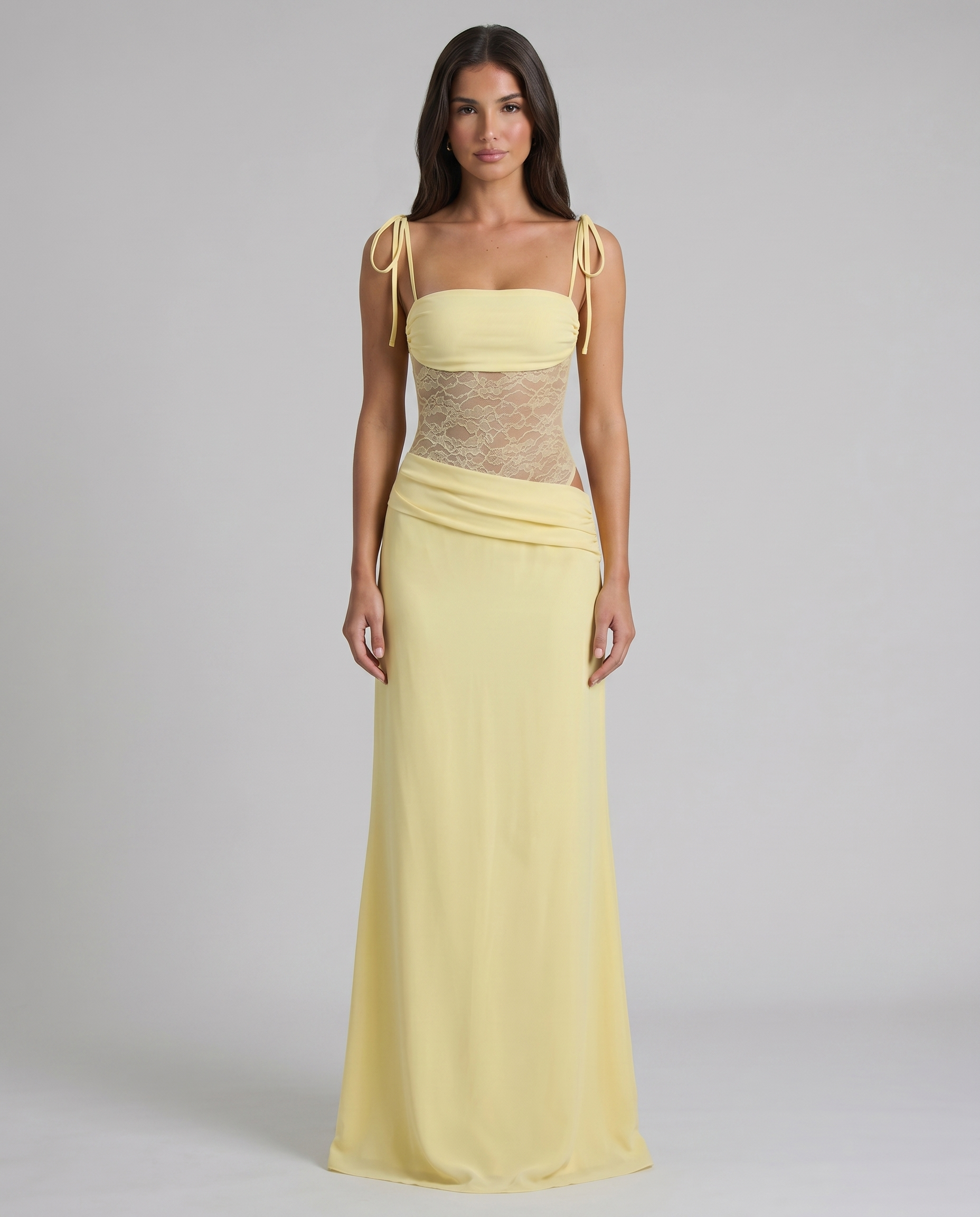 Front view pale yellow maxi dress with tie shoulder straps, lace bodice, and floor-length skirt