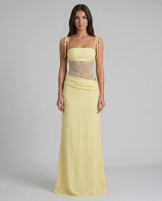 Front view pale yellow maxi dress with tie shoulder straps, lace bodice, and floor-length skirt