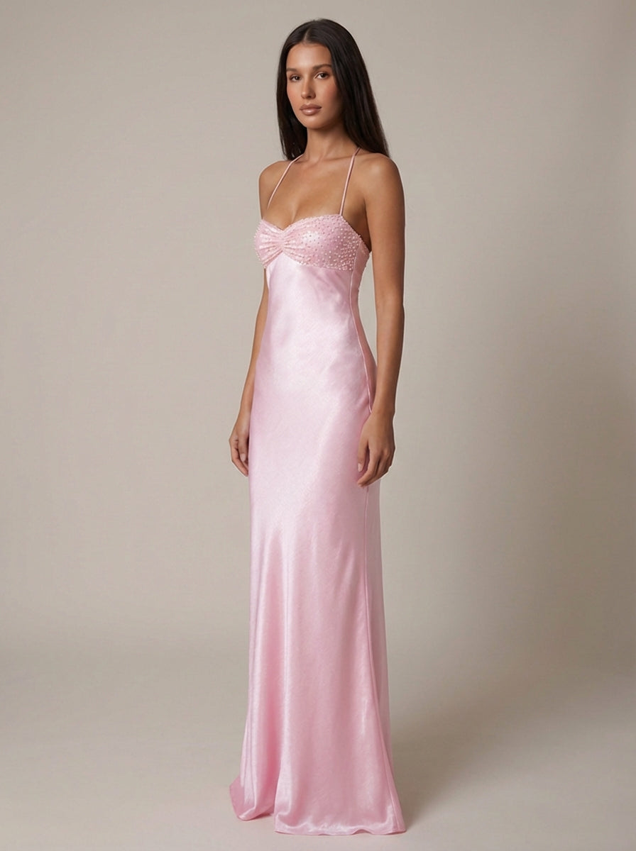 Three-quarter front view of pink satin maxi dress with sweetheart beaded bodice and straps