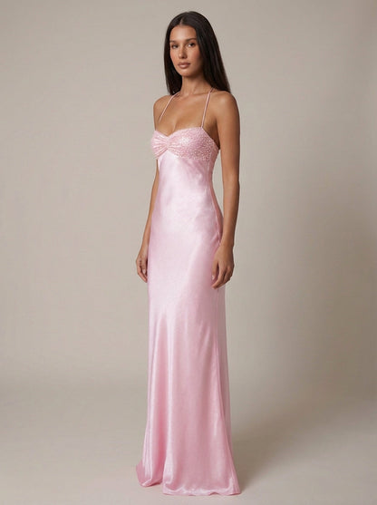 Three-quarter front view of pink satin maxi dress with sweetheart beaded bodice and straps