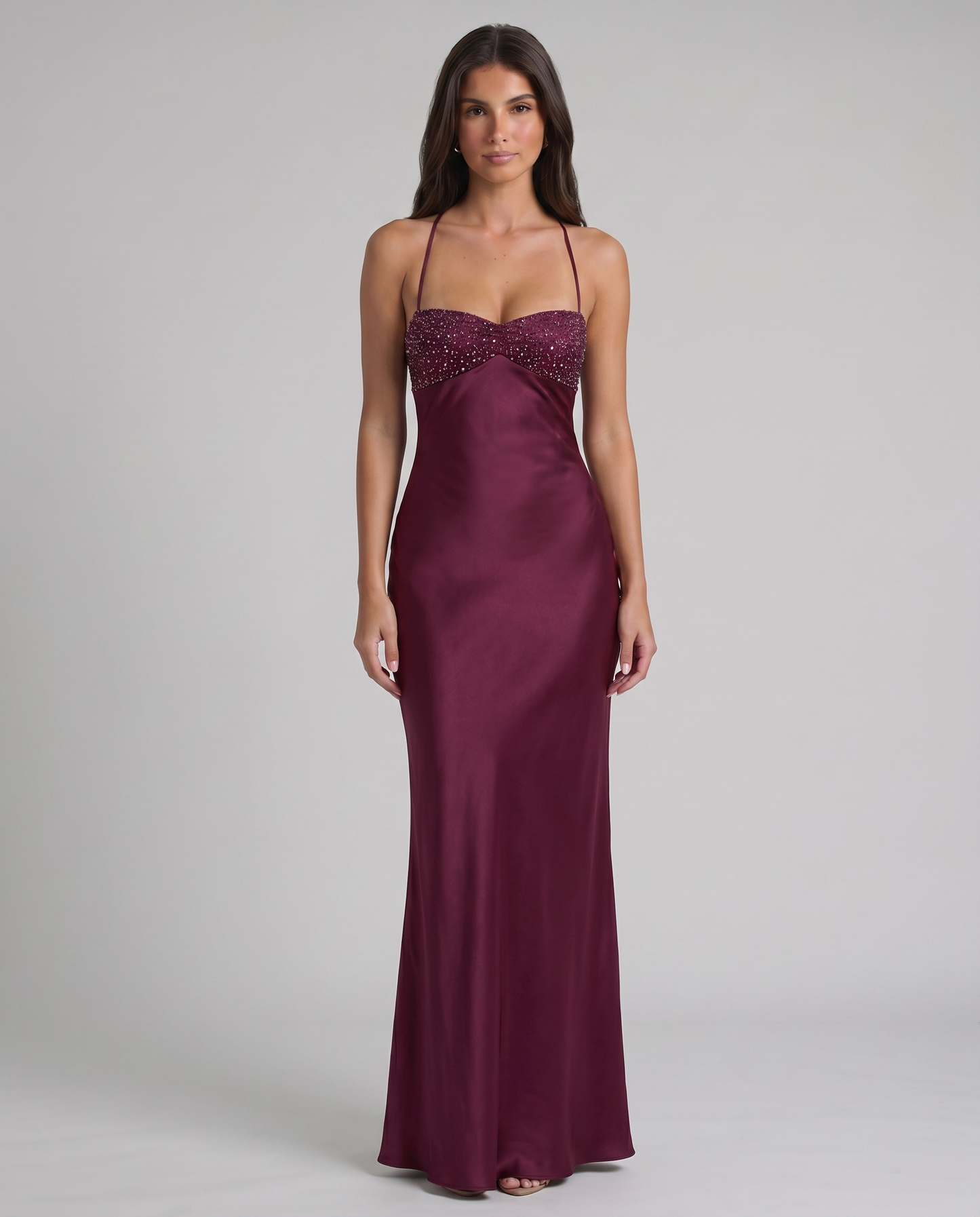 Front view of purple maxi dress with crystal beaded bustier top and smooth satin floor-length skirt