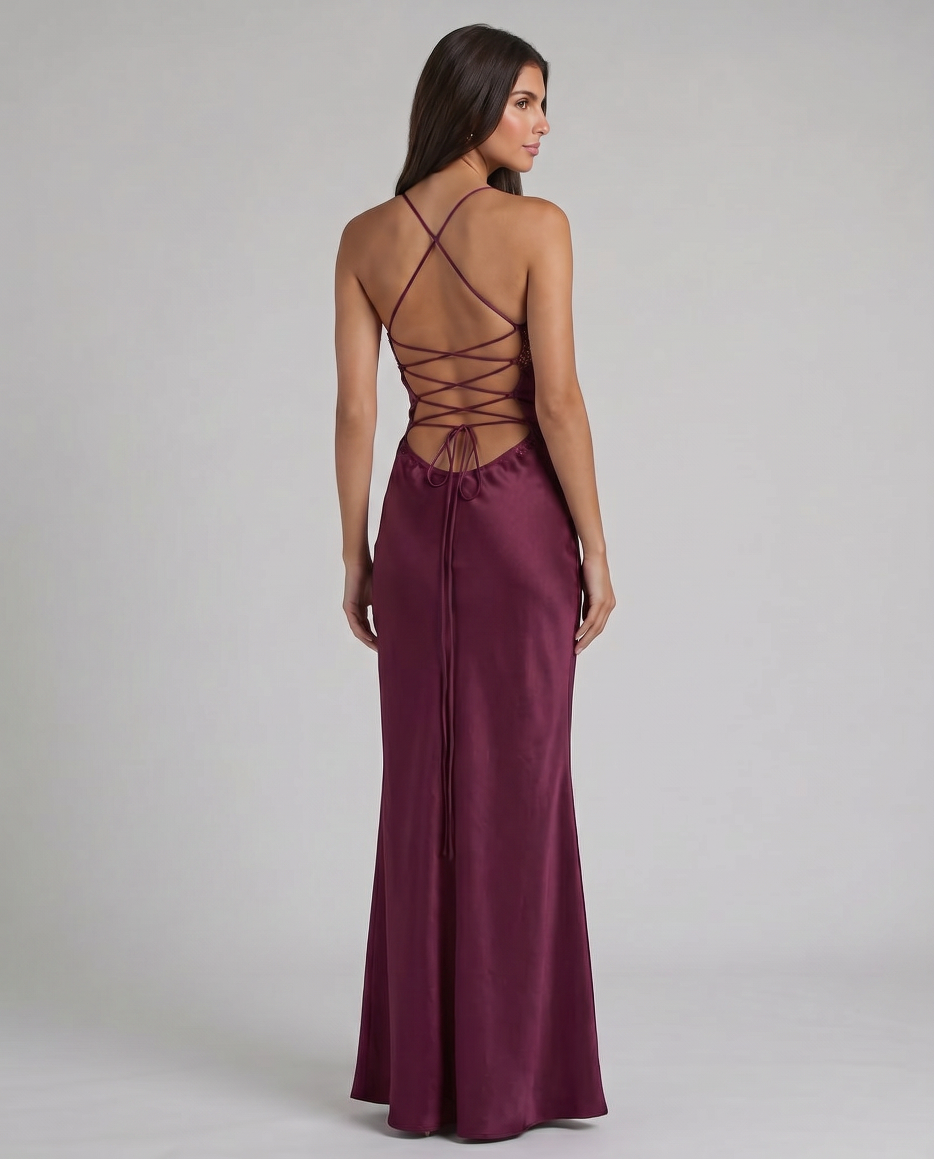 Back view of purple satin maxi dress with crisscross lace-up open back and floor-length skirt