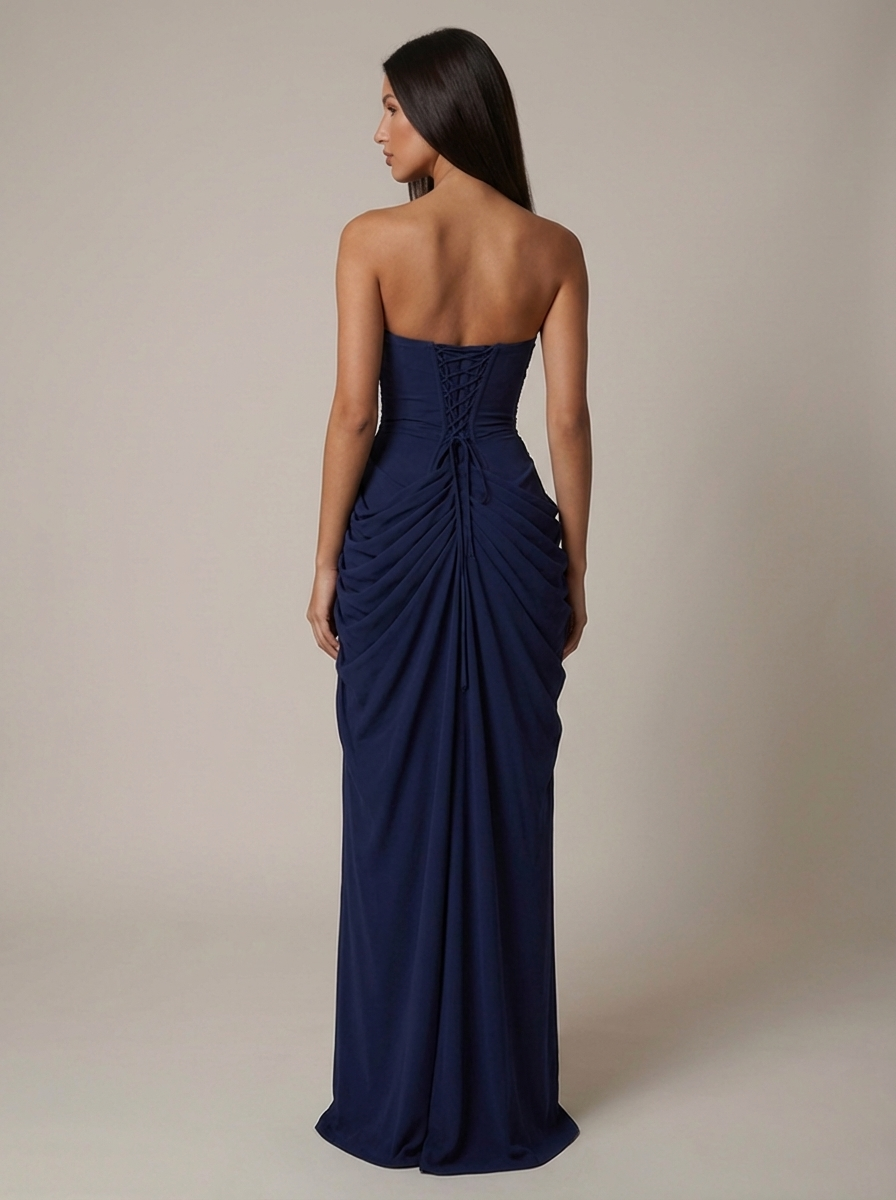 Back view navy strapless maxi dress with lace-up corset back and gathered draped skirt