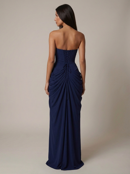 Back view navy strapless maxi dress with lace-up corset back and gathered draped skirt