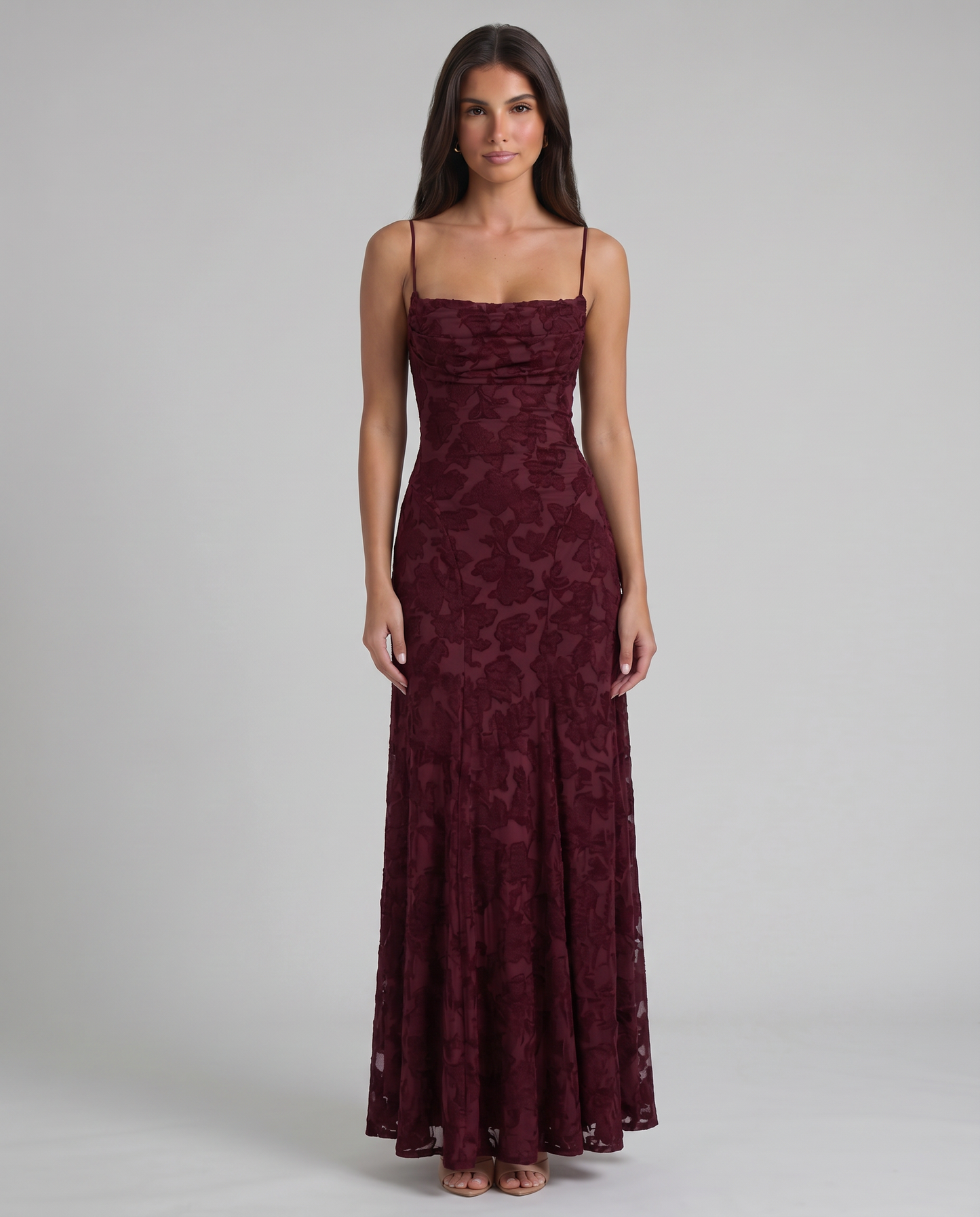Full-length side view burgundy floral maxi dress showing smooth fit through hips and flowy skirt