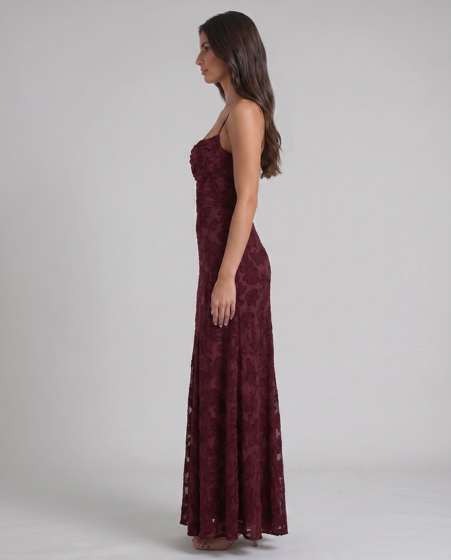 Front mid-length view burgundy maxi dress highlighting floral burnout pattern and fitted waist