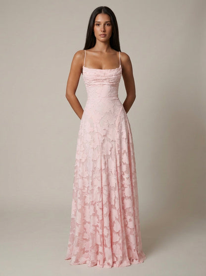 Full-length front view of blush pink maxi dress with floral texture and floor-sweeping hemline