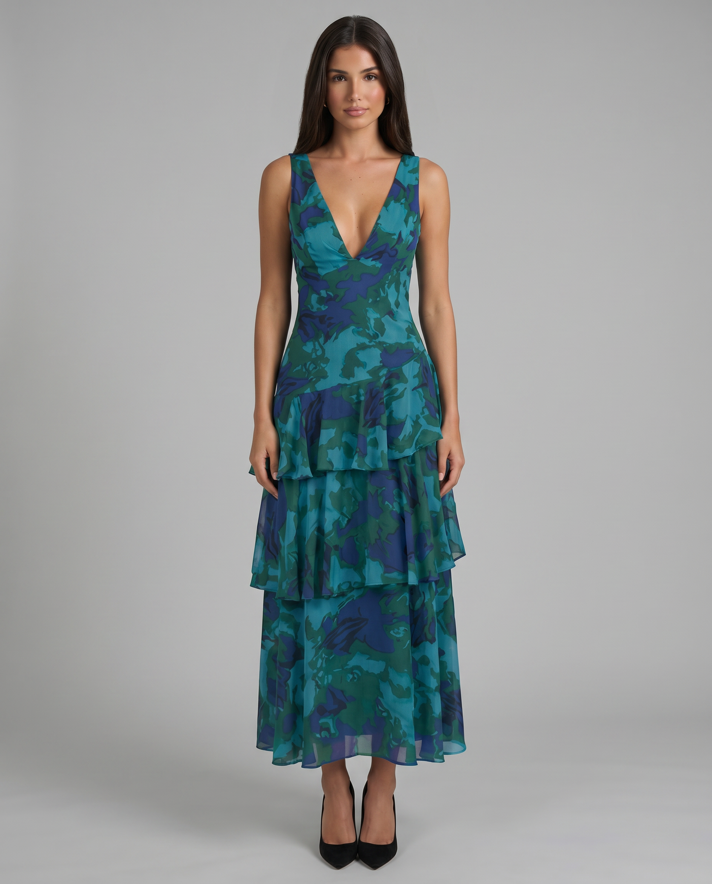 Front view of blue printed sleeveless maxi dress with deep V-neck and tiered ruffle skirt
