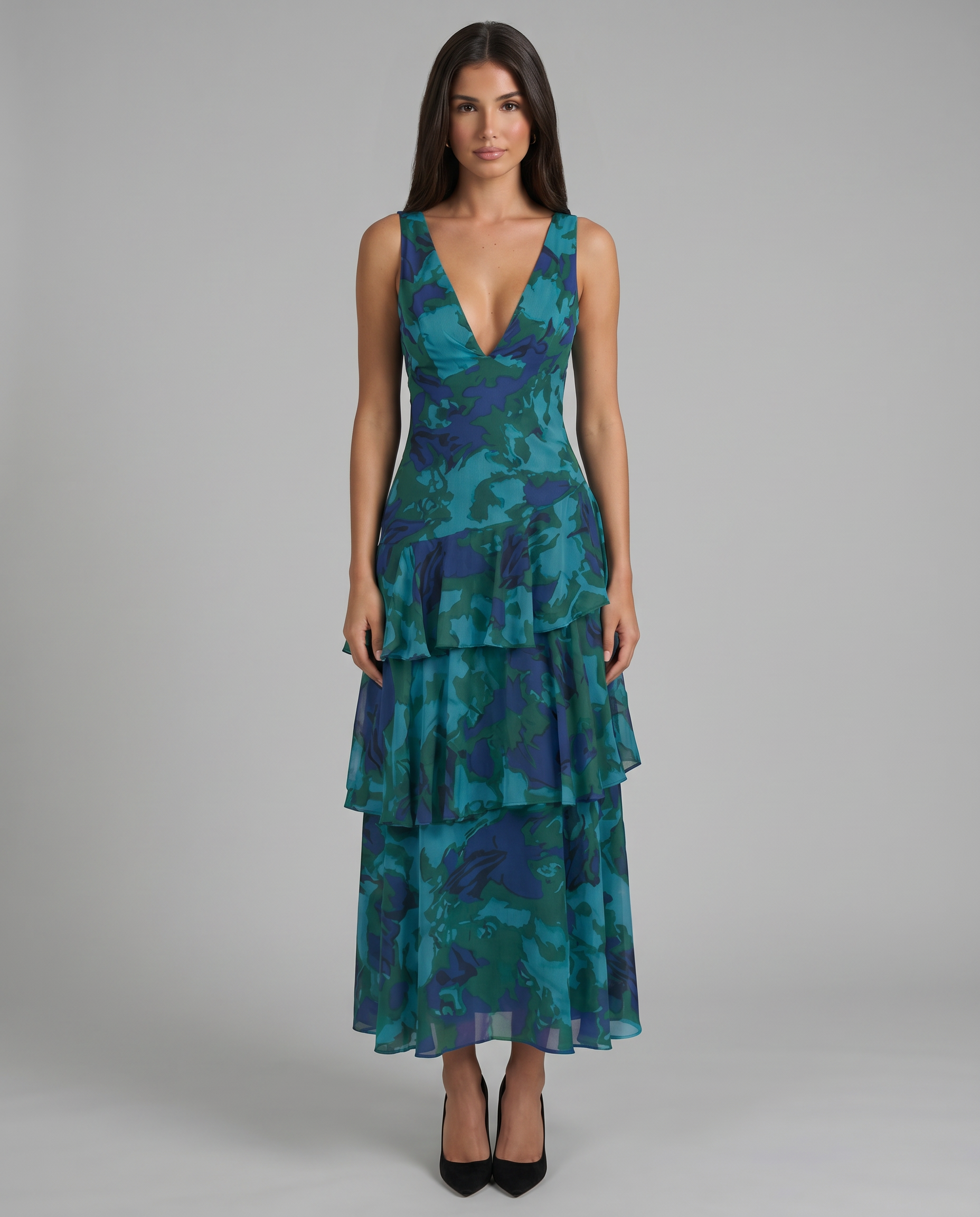 Front view of blue printed sleeveless maxi dress with deep V-neck and tiered ruffle skirt