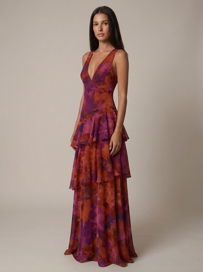 Angled front view purple maxi dress with plunge V-neck, waist seam and multi-tier chiffon skirt