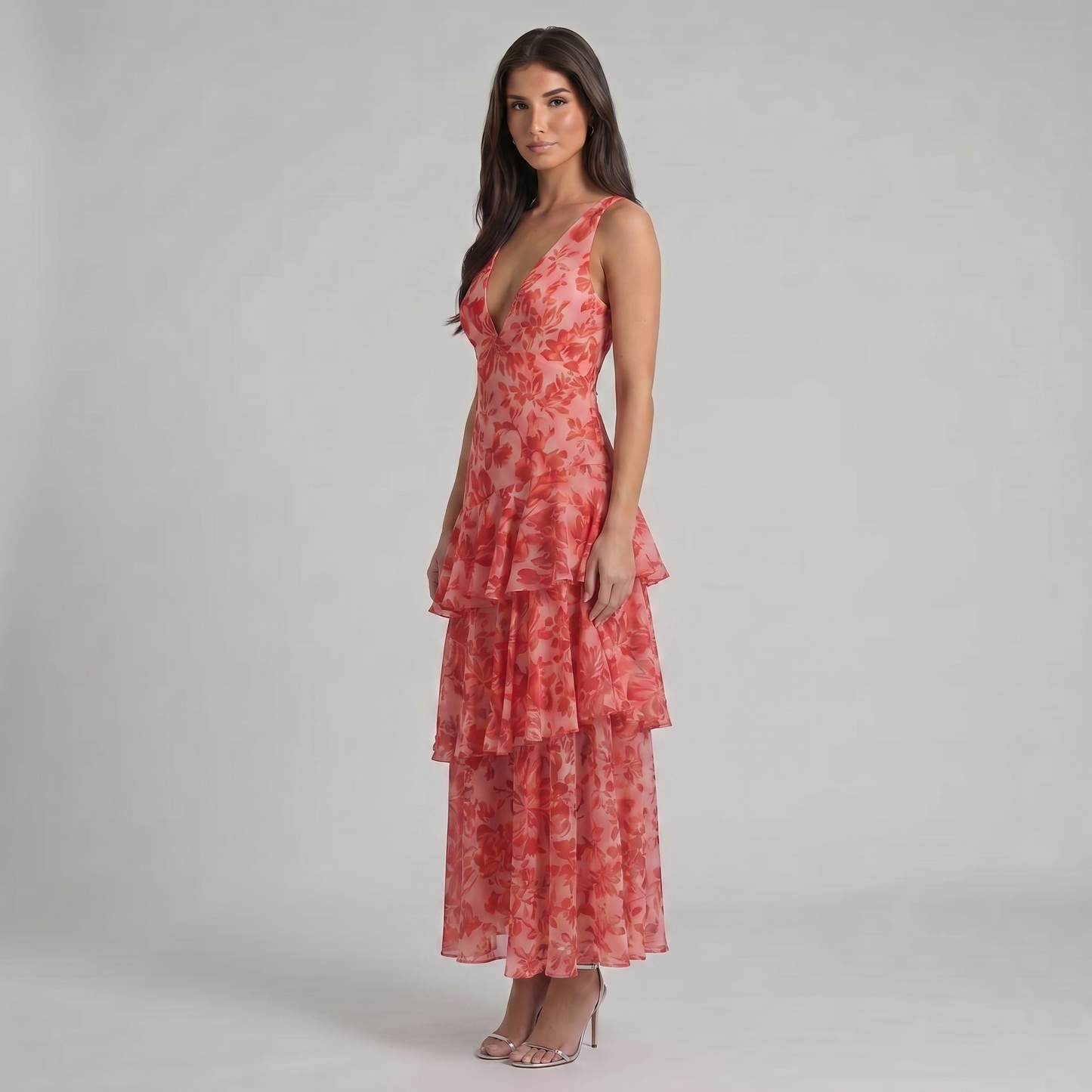 Three-quarter view red floral maxi dress featuring sleeveless plunge neckline and layered skirt