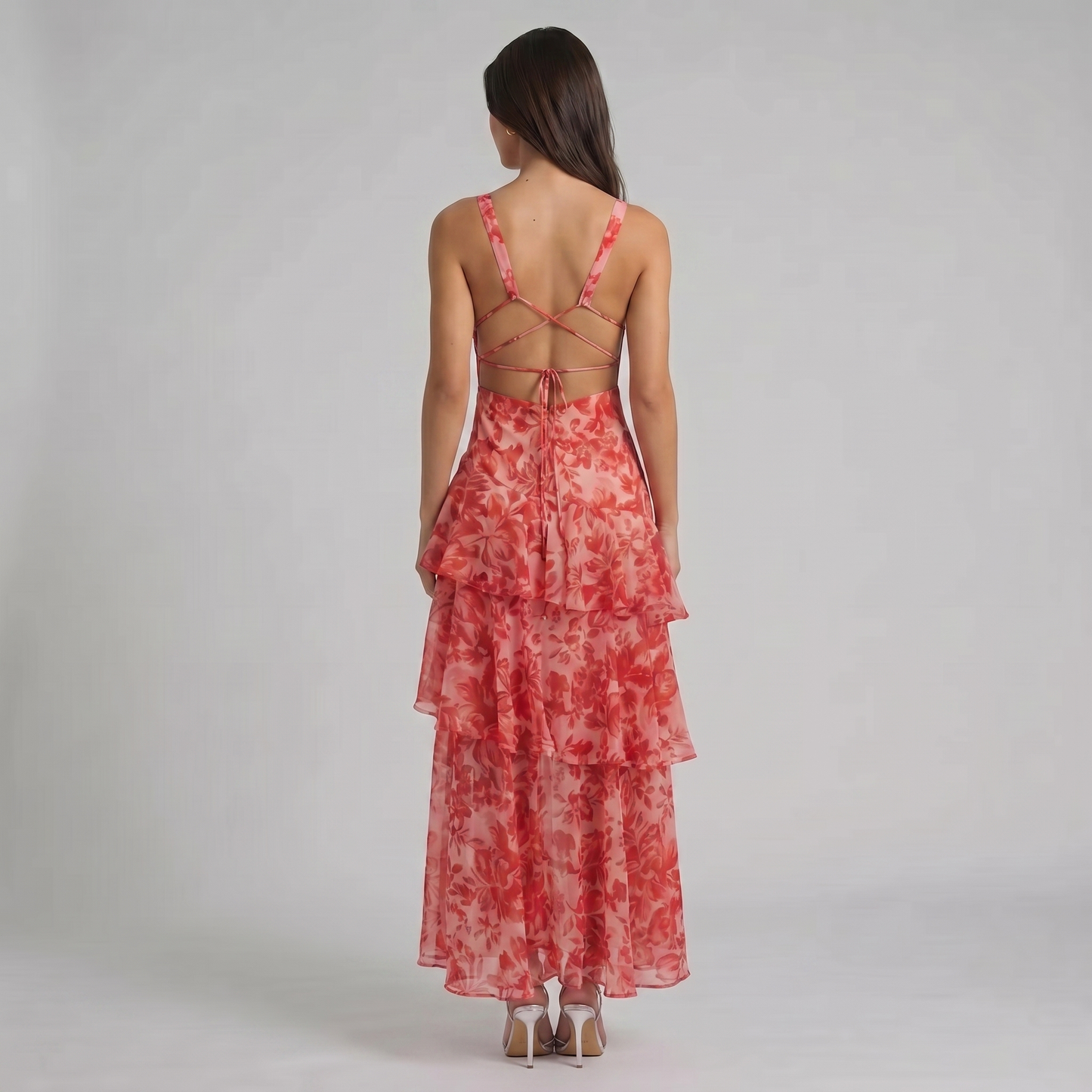 Back view red floral maxi dress with open back, crisscross straps, and adjustable tie detail