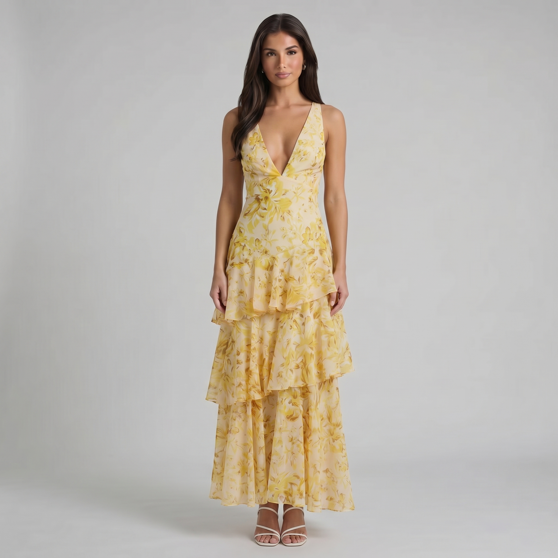 Front cropped view of yellow floral maxi dress showing plunging neckline and top tier ruffles