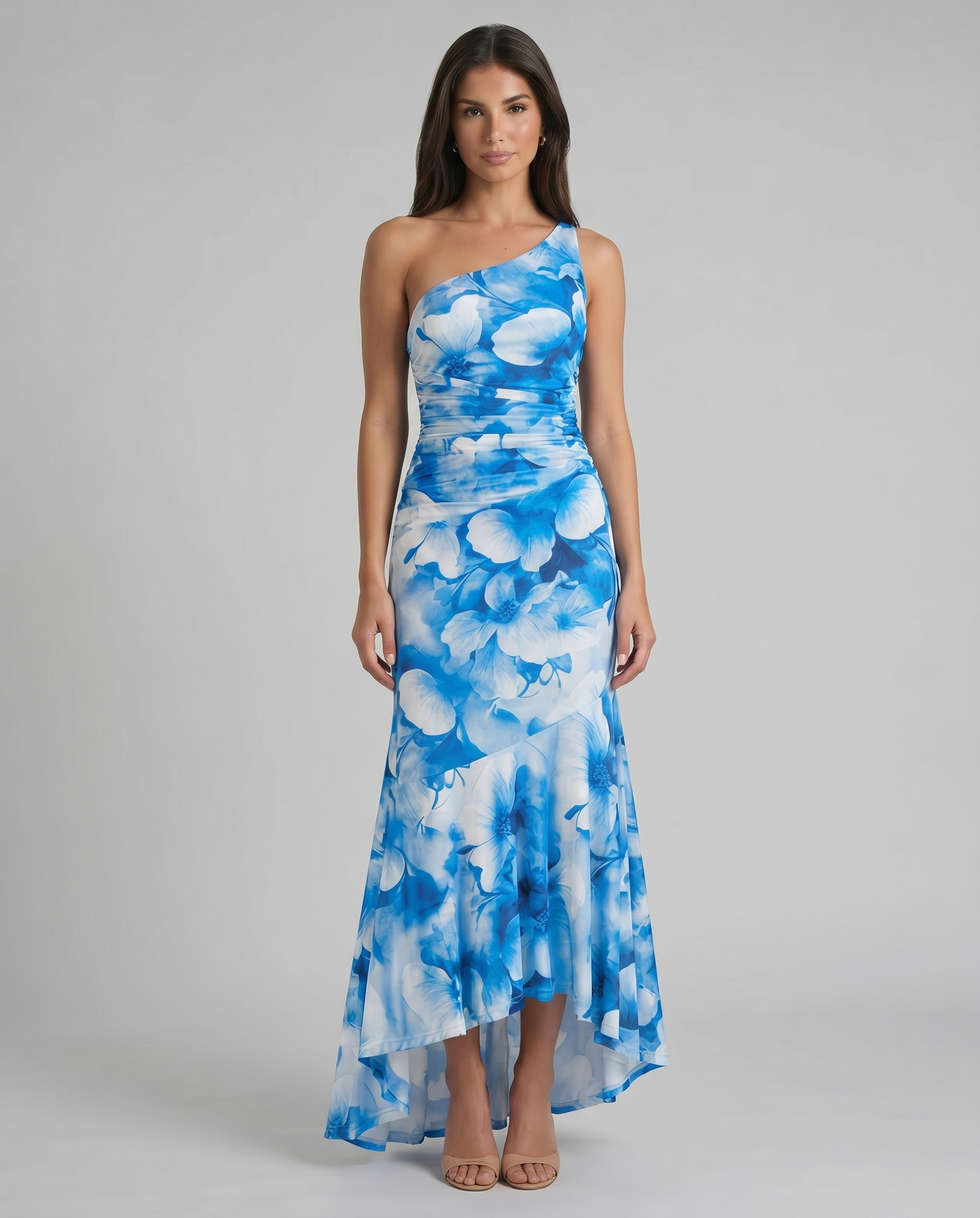 Blue and white floral one-shoulder maxi dress with ruched bodice and flowing skirt, front view