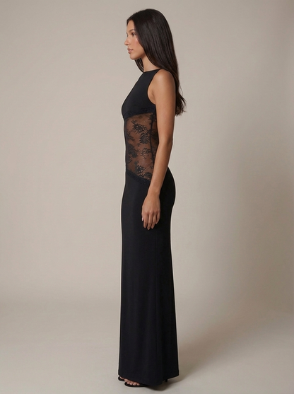 Side profile black floor-length maxi dress showing sheer lace midsection and slim fit silhouette