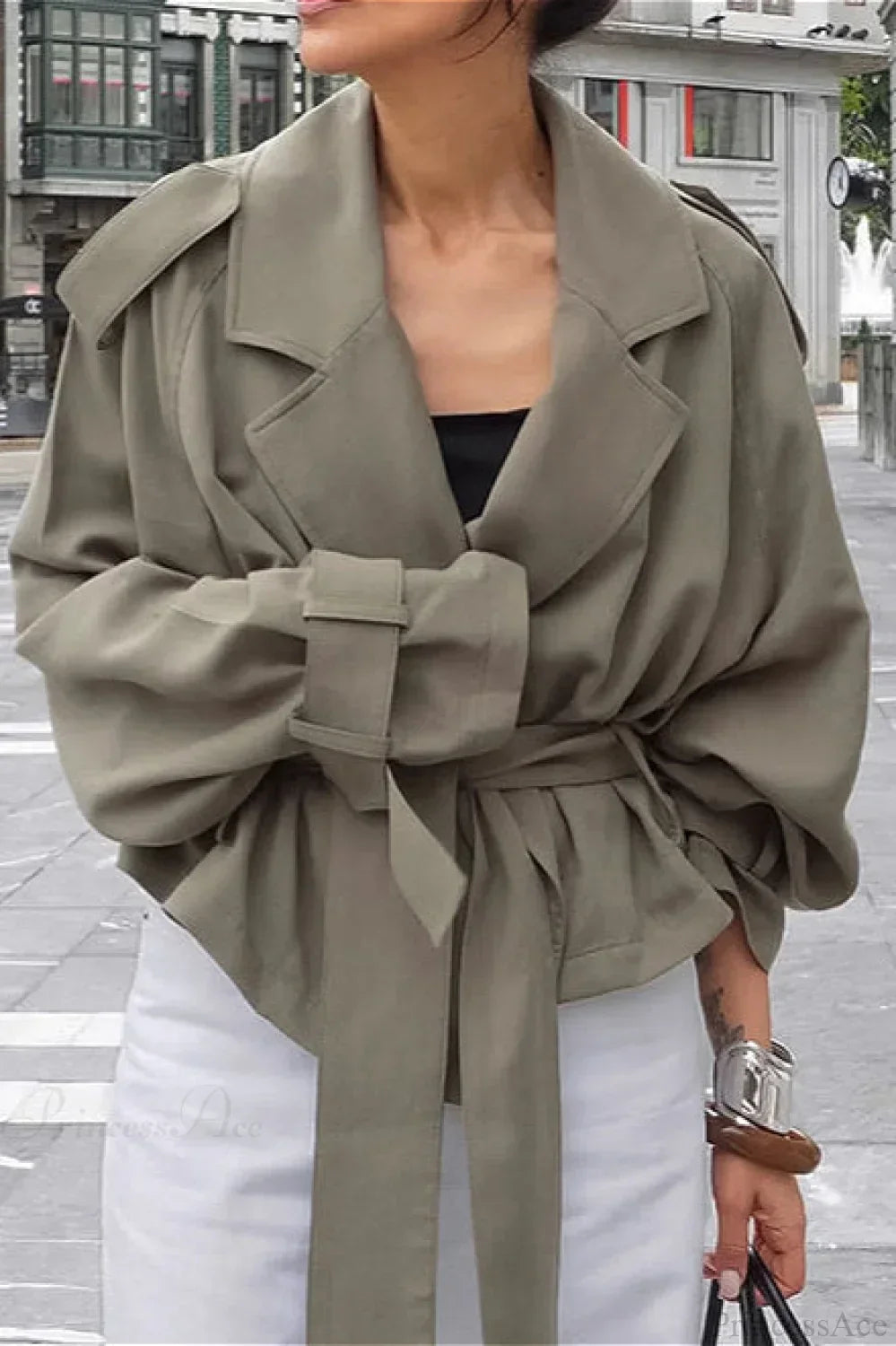 Women green wrap jacket with notch lapel, epaulettes and tie belt