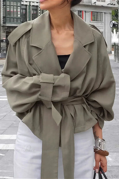 Women green wrap jacket with notch lapel, epaulettes and tie belt