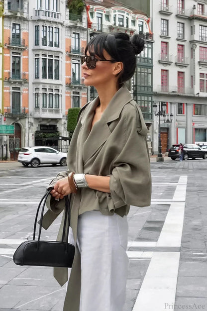 Women green wrap jacket with notch lapel, epaulettes and tie belt