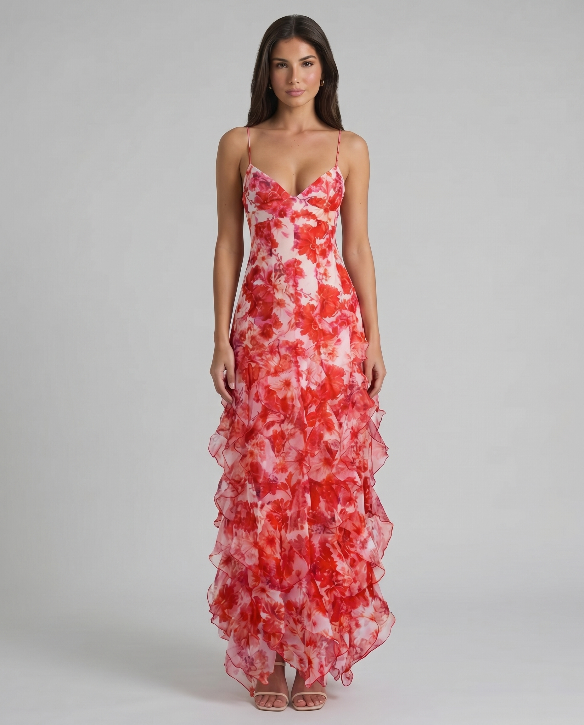 Front view of red floral maxi dress with spaghetti straps, v-neck bodice, and ruffle hem