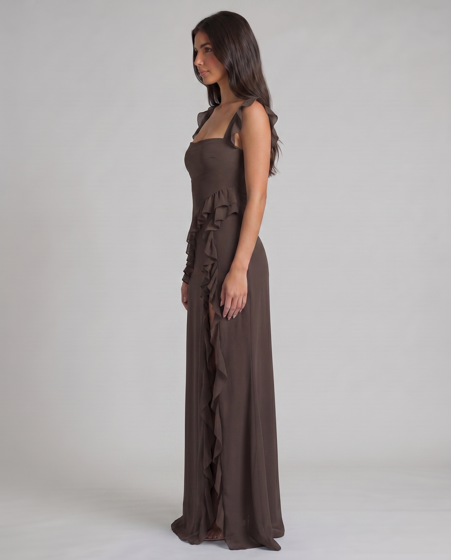 Back bodice close-up of black maxi dress showing square back, zipper closure and ruffle strap finish