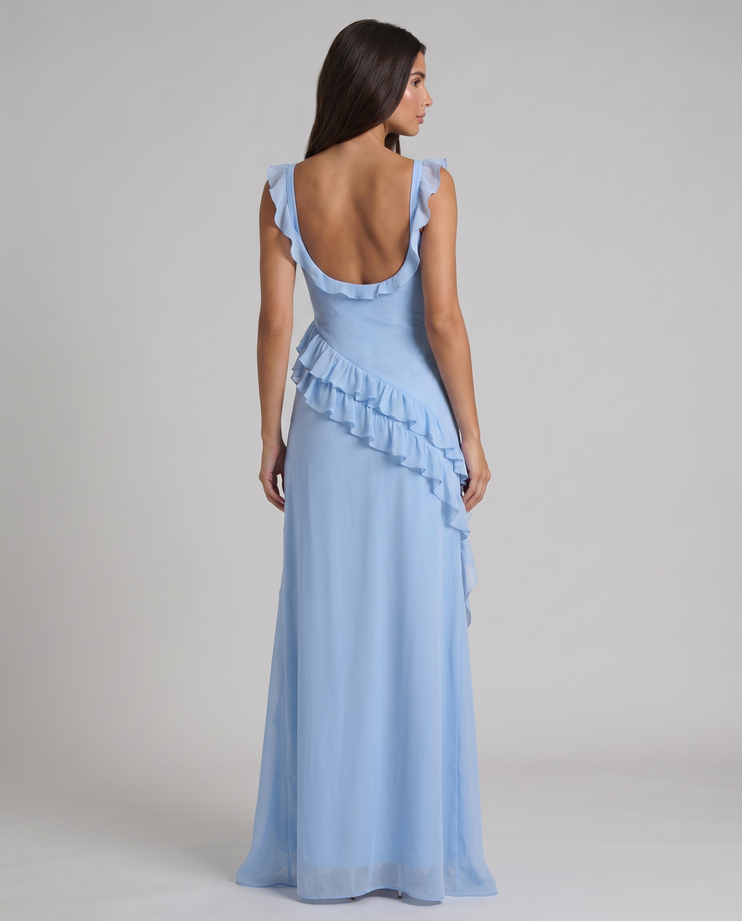 Back view of light blue maxi dress with deep scoop back, flutter sleeves and ruffle detail
