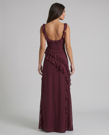 Full-length purple maxi dress showing cascading ruffles along the skirt and high leg slit