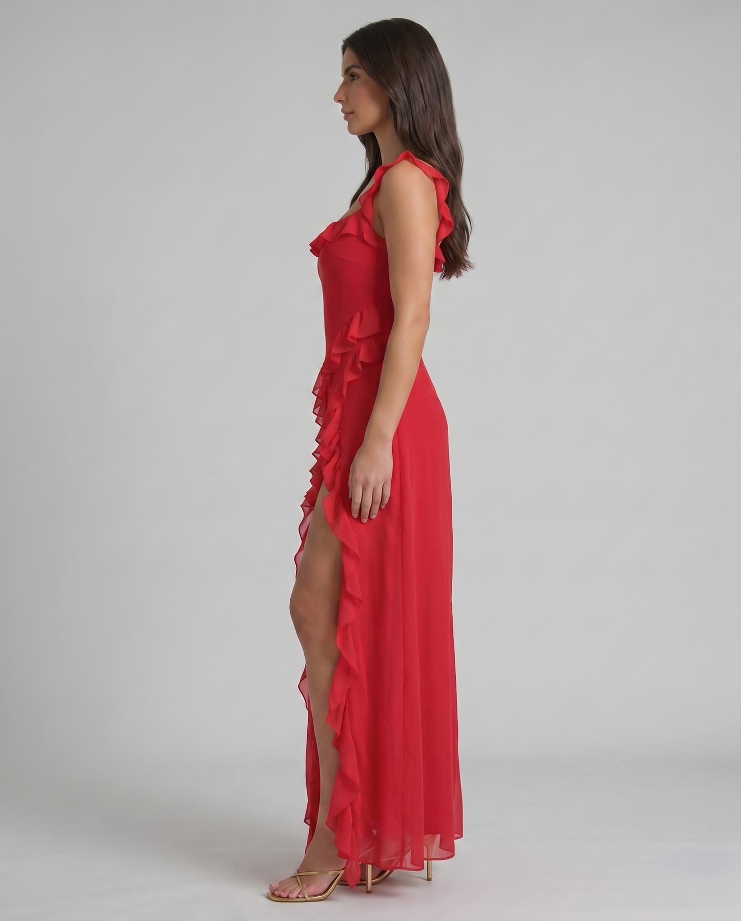 Left side view red maxi dress with ruffle neckline, cascading side ruffles and ankle-length hem