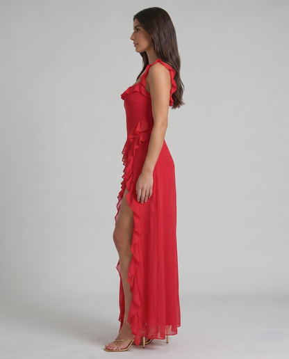Left side view red maxi dress with ruffle neckline, cascading side ruffles and ankle-length hem