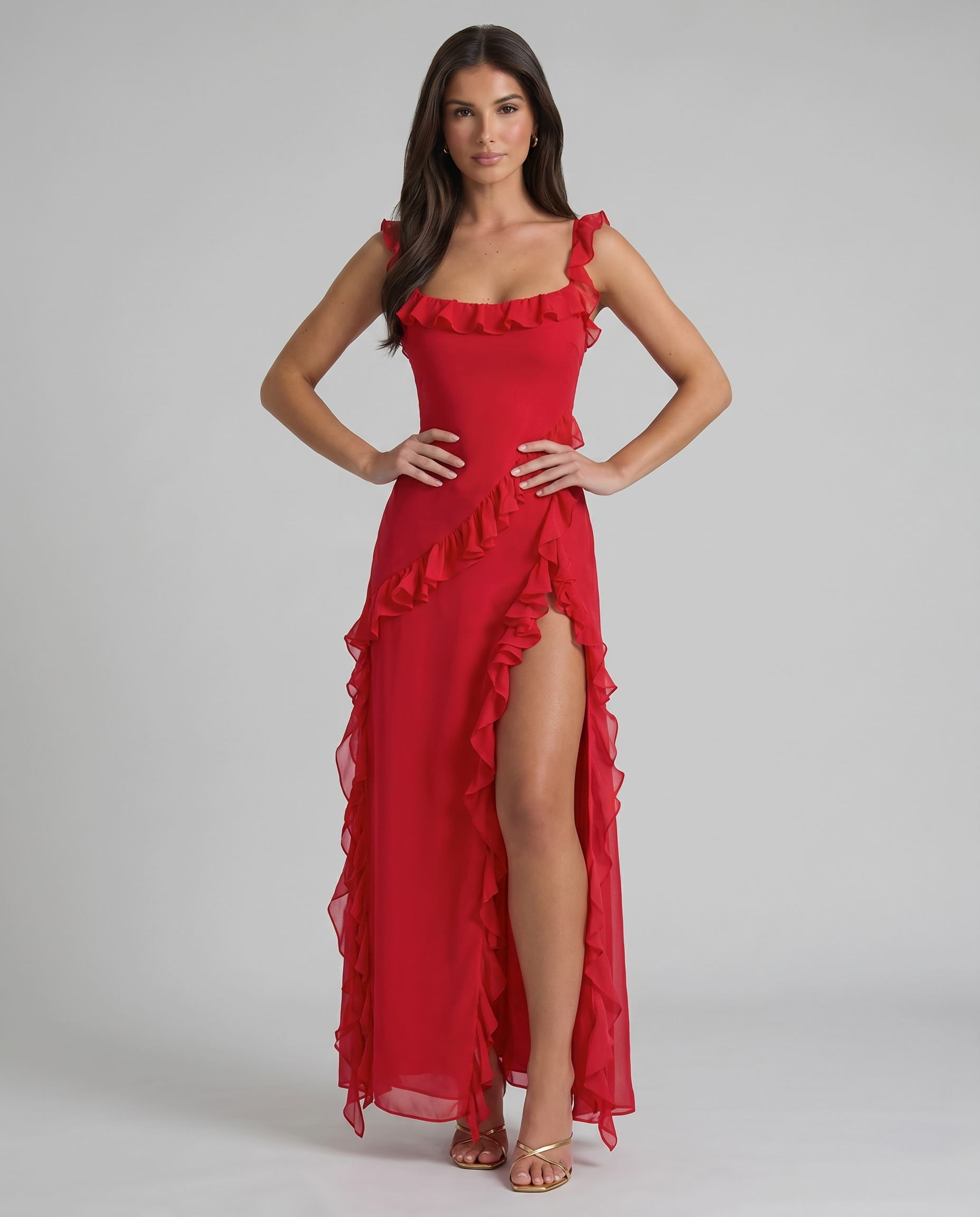 Front mid-length view red maxi dress showing cascading ruffle panel and high slit opening