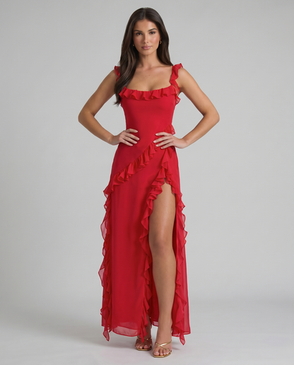 Front view red maxi dress with ruffle square neckline, cascading ruffle trim and high slit