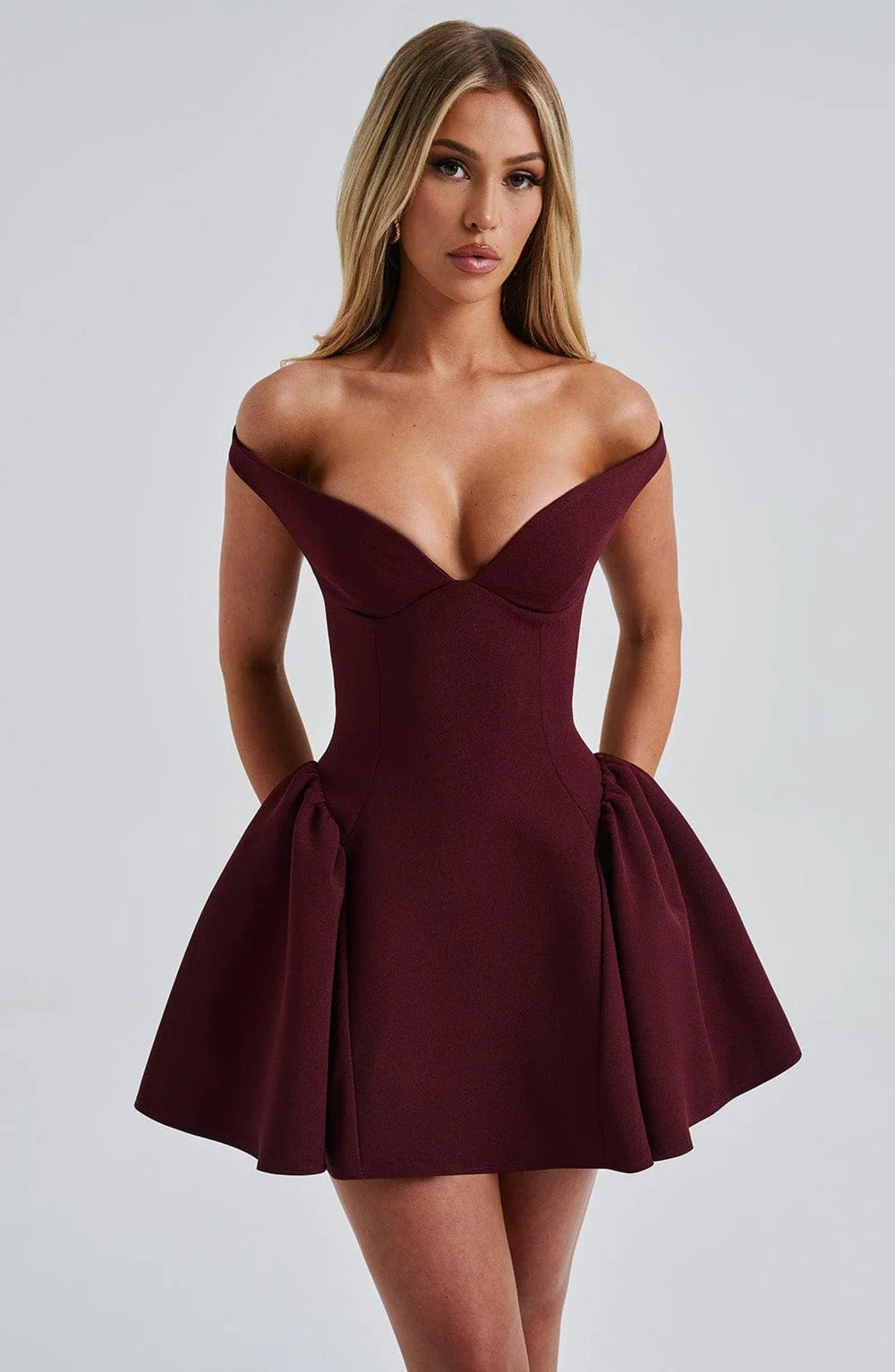Burgundy off-the-shoulder mini dress with sweetheart neckline, fitted bodice and flared skirt