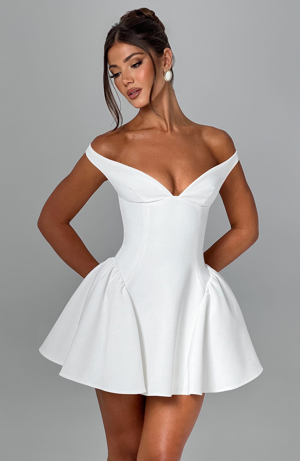 White off-shoulder mini dress with sweetheart neckline, fitted bodice and flared skirt detail