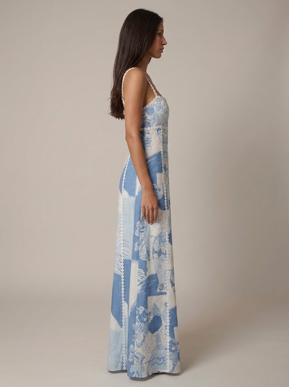 Left side view of blue printed midi dress with straight neckline and lace-trim panel seams