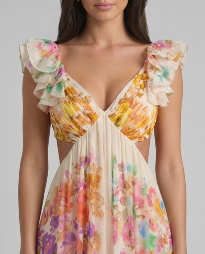Close-up of V-neck bodice on multicolor floral midi dress with layered ruffle sleeves and pleats