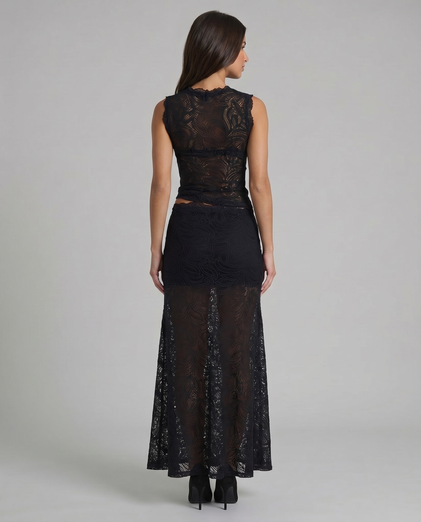 Back view of black lace sleeveless top and sheer lace maxi skirt in matching two-piece set