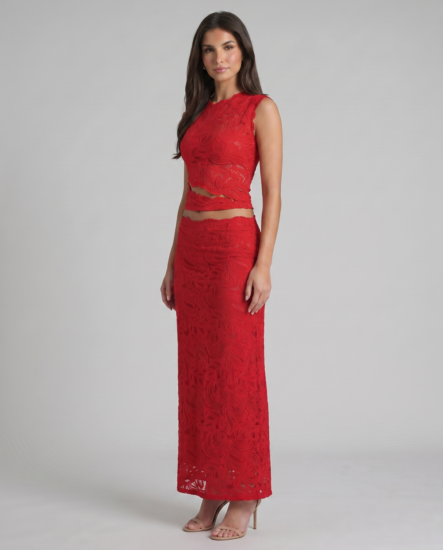 Angle view of red lace crop top and matching maxi skirt set with scalloped hem details