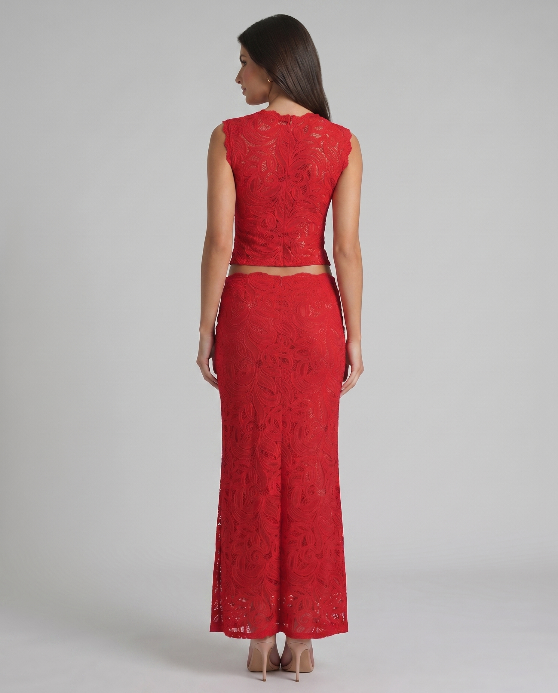 Back view of red lace two-piece set showing sleeveless top closure and fitted maxi skirt