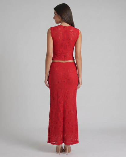 Back view of red lace two-piece set showing sleeveless top closure and fitted maxi skirt