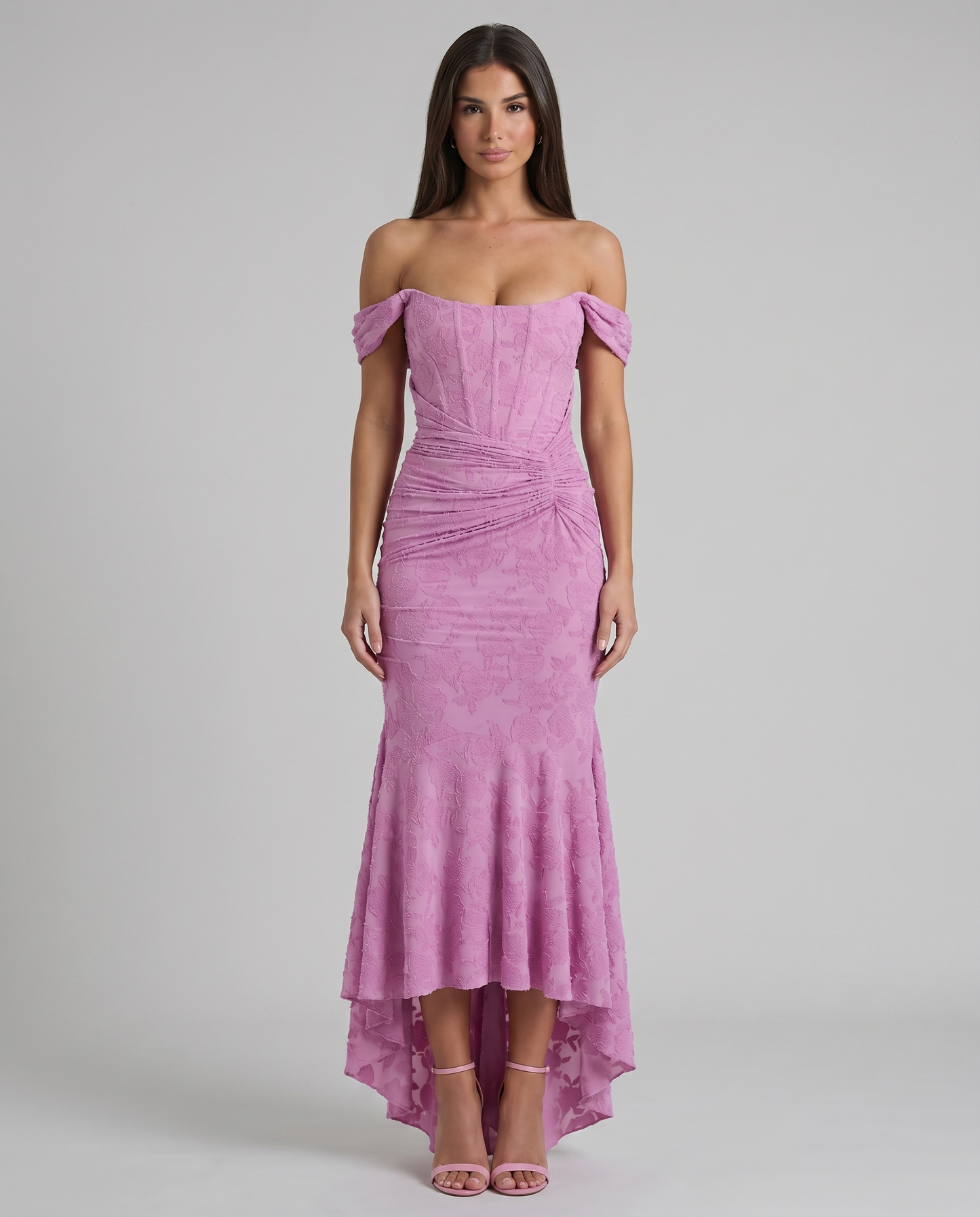 Front view of pink corset maxi dress with off-shoulder sleeves, ruched waist and high-low hem