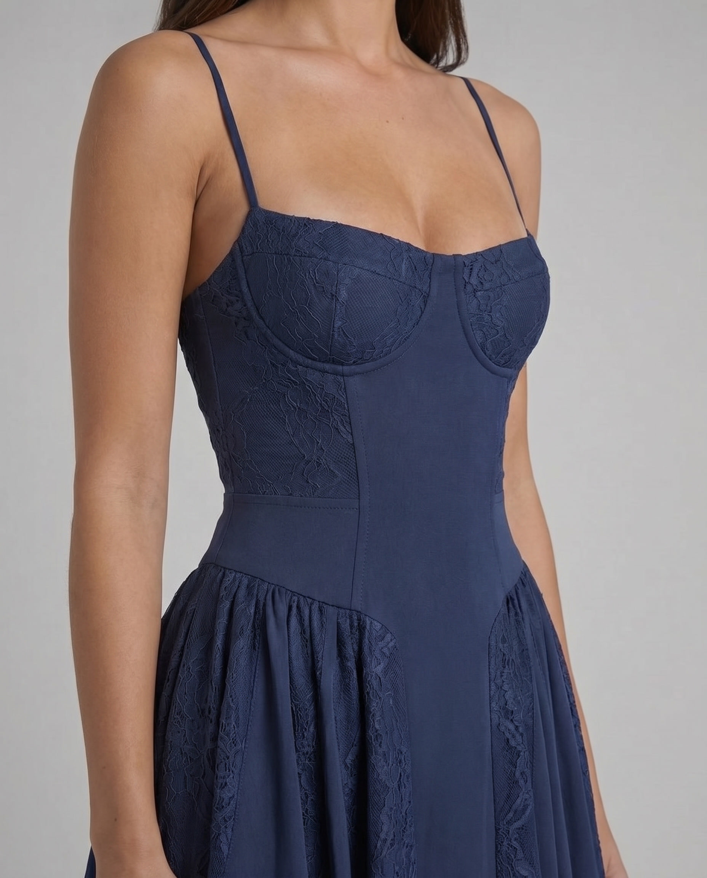 Detail of blue midi dress showing lace overlay on the bust and smooth fitted bodice with thin straps