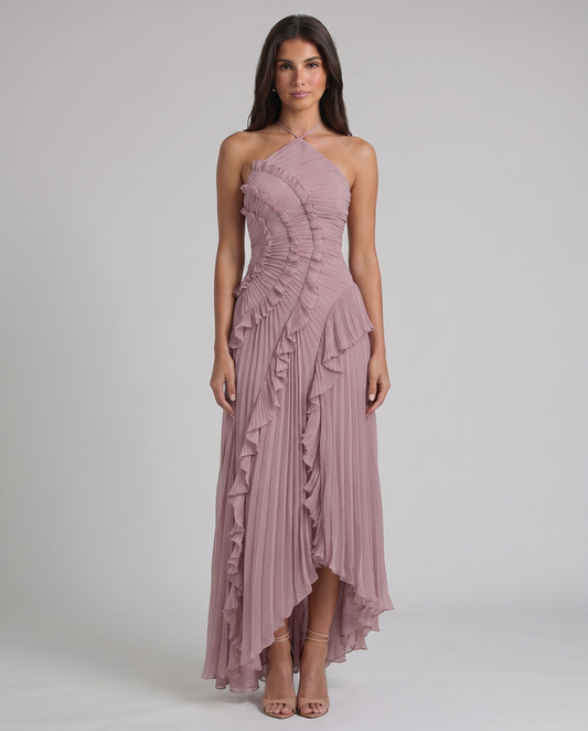 Pink pleated halter maxi dress with cascading ruffle trim and asymmetrical high-low hem, front view