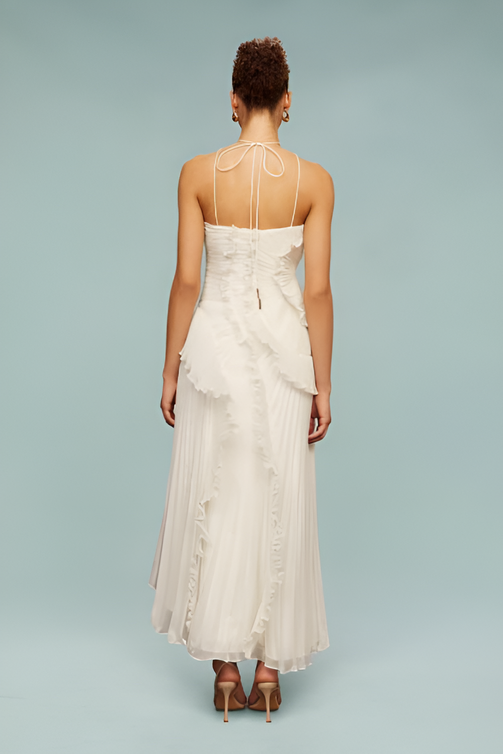 Full back view white maxi dress with slim tie straps, back zipper detail and flowy pleated skirt