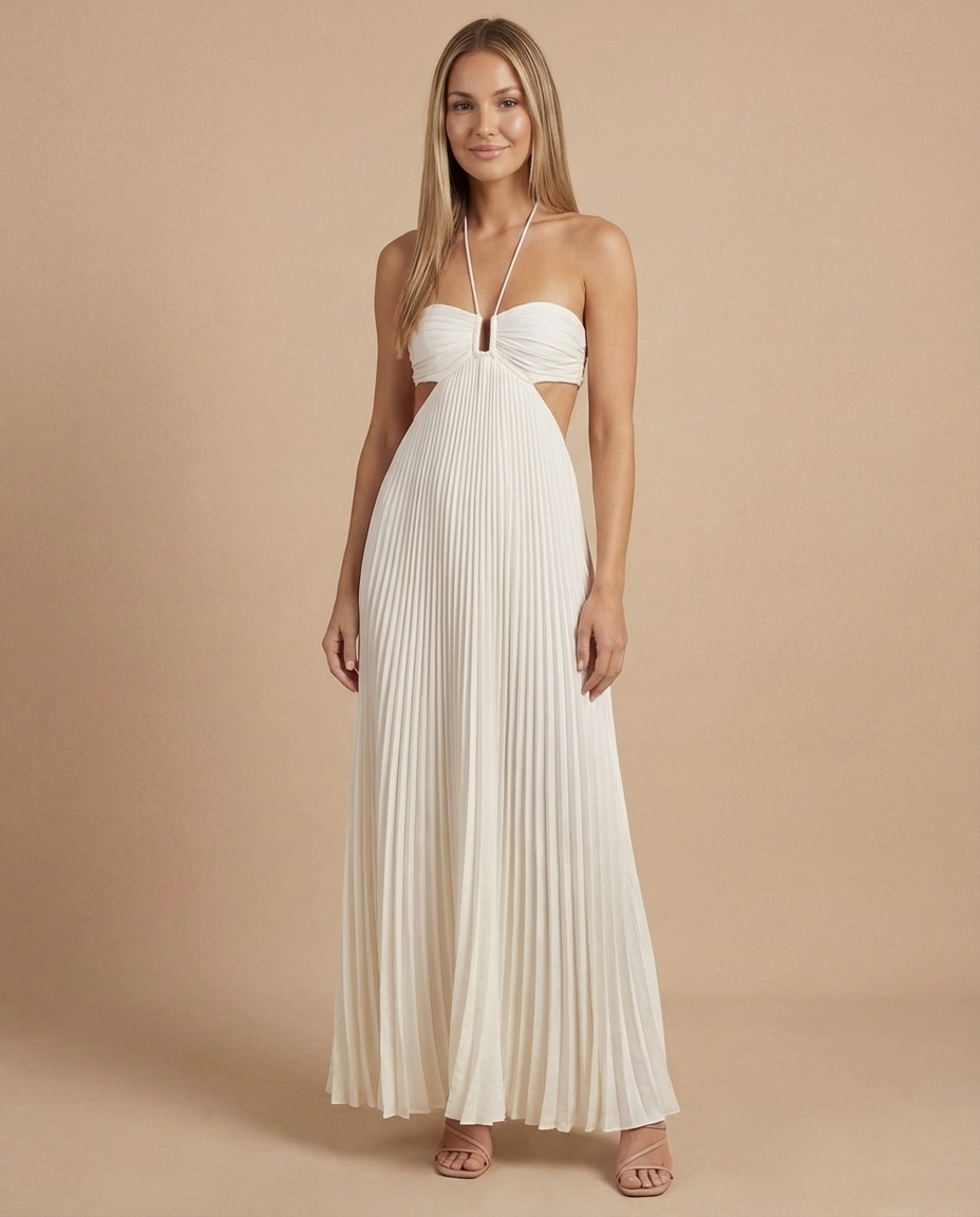 Front view of white maxi dress featuring ruched bandeau top, halter neckline, and pleated skirt