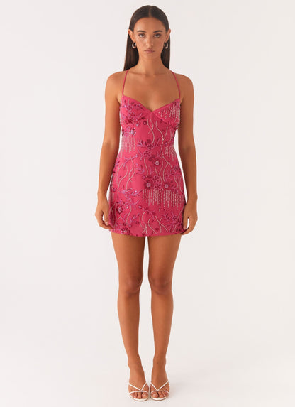 Fuchsia sequin mini dress with spaghetti straps and fitted silhouette, front full-length view